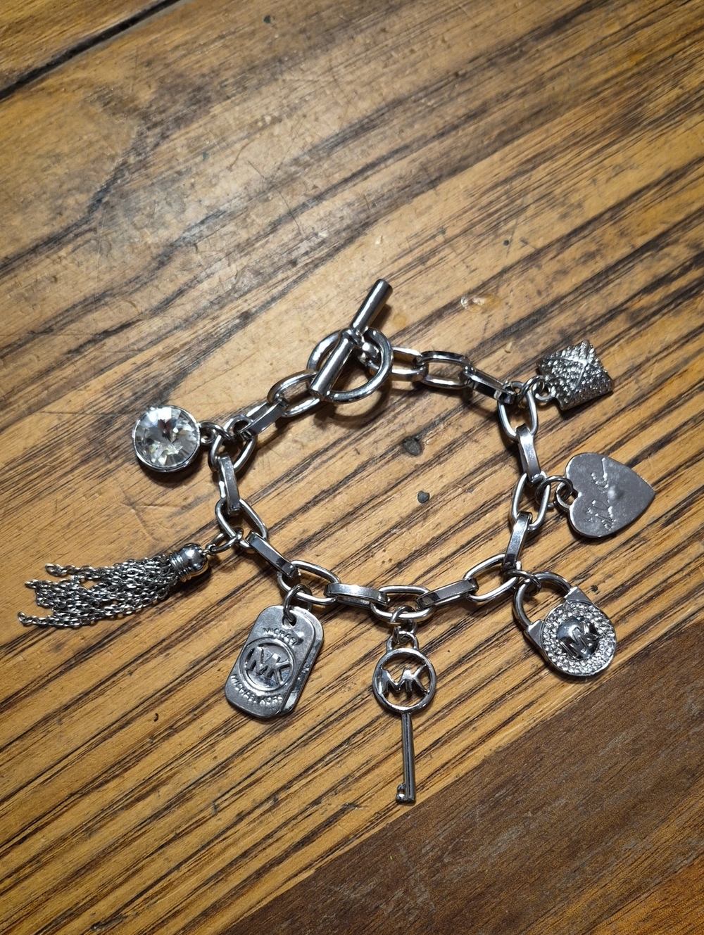 MICHAEL Michael Kors Silver-Tone Logo Charm Bracelet with Tassel